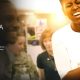 Documentários Inspiradores: Foto de Michelle Obama sorrindo com uma criança no colo juntamente com o nome Minha HIstória na capa do documentário na Netflix